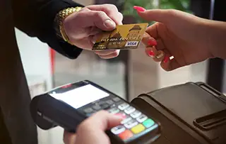 person making transaction with credit card and mobile terminal